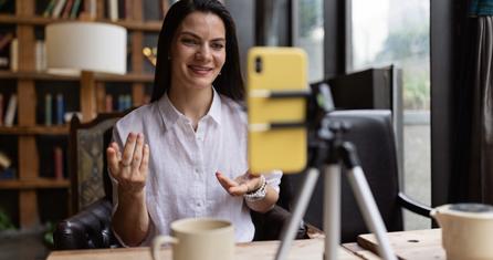 Woman filming herself with a phone