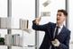 businessman in formal business suit throwing away money