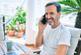 middle age man with beard smiling happy at the terrace 