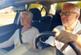 Older couple driving car