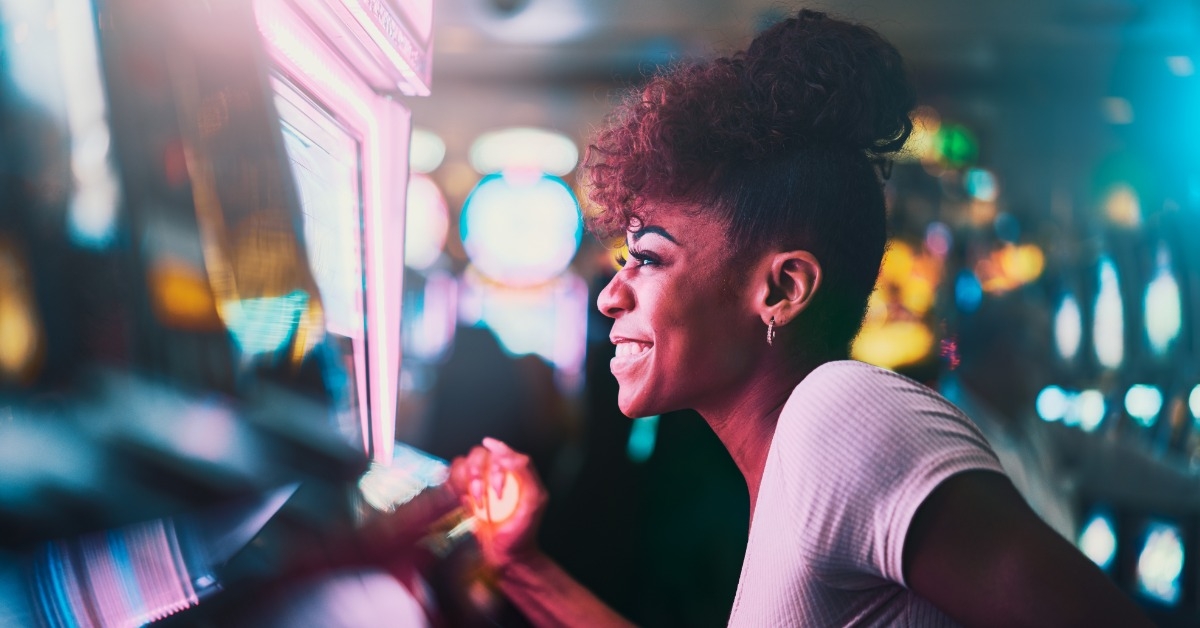 Woman playing slots at casino
