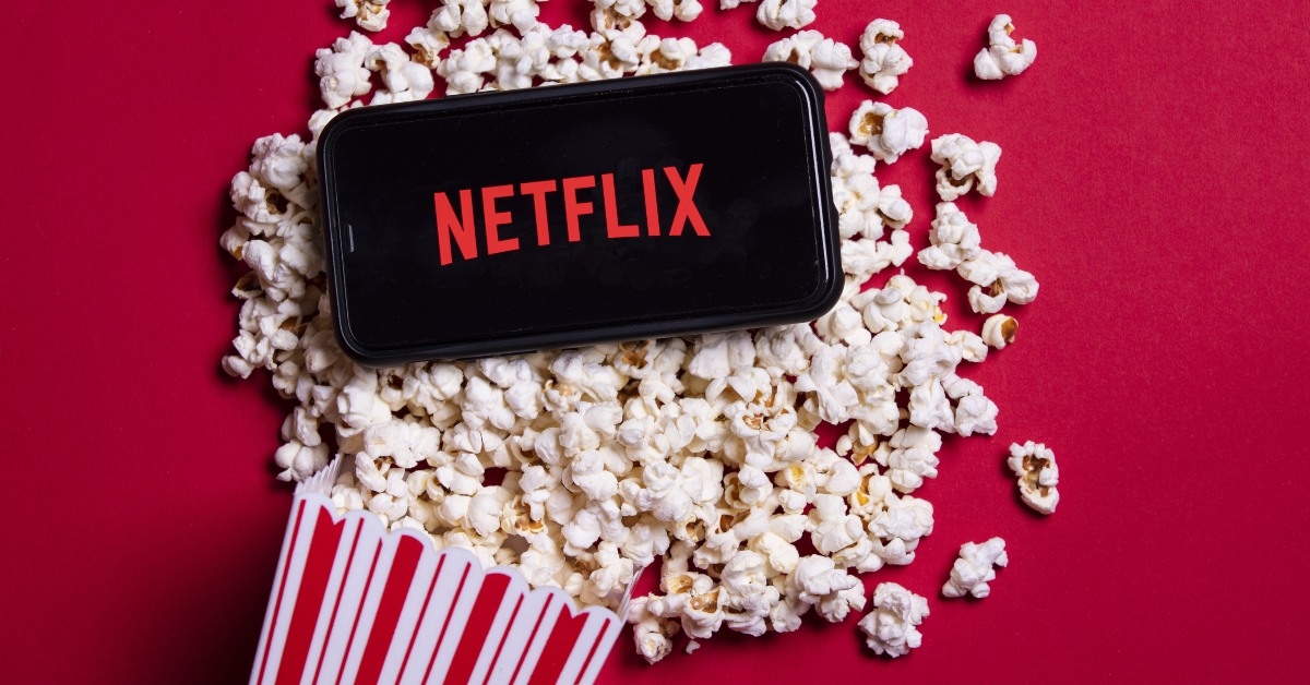 Netflix app on phone and popcorn