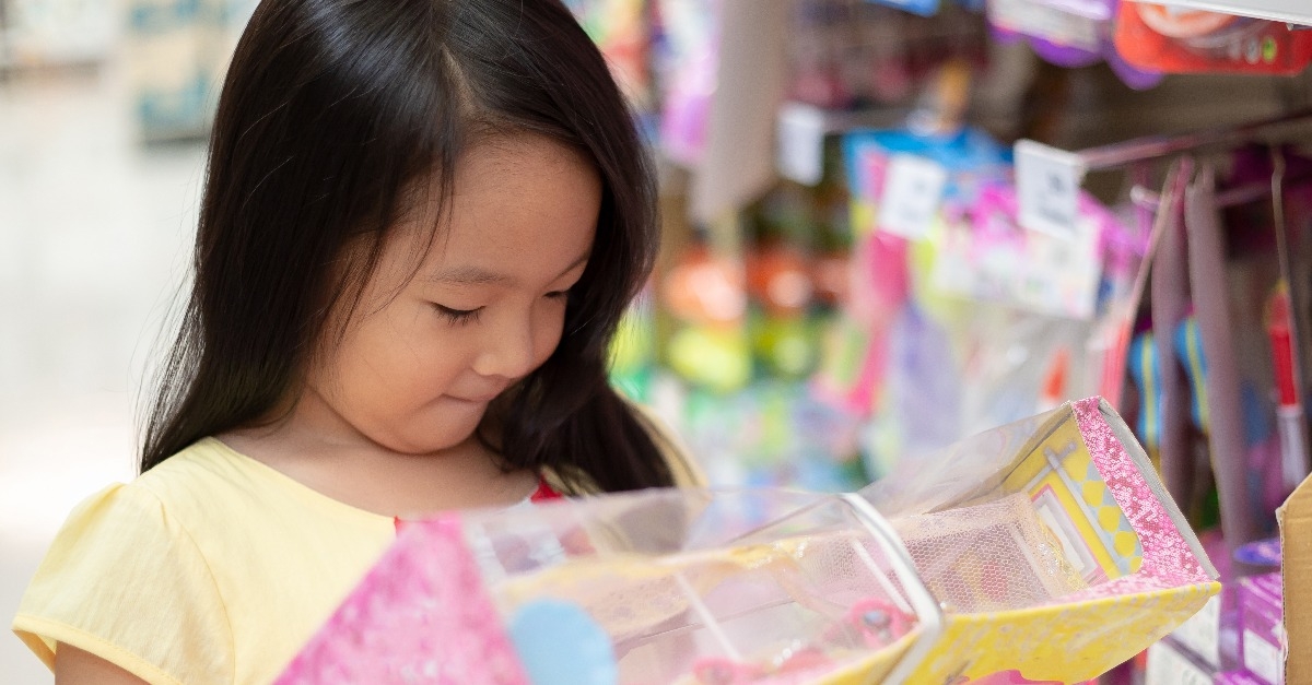 girl shops for toys at department store