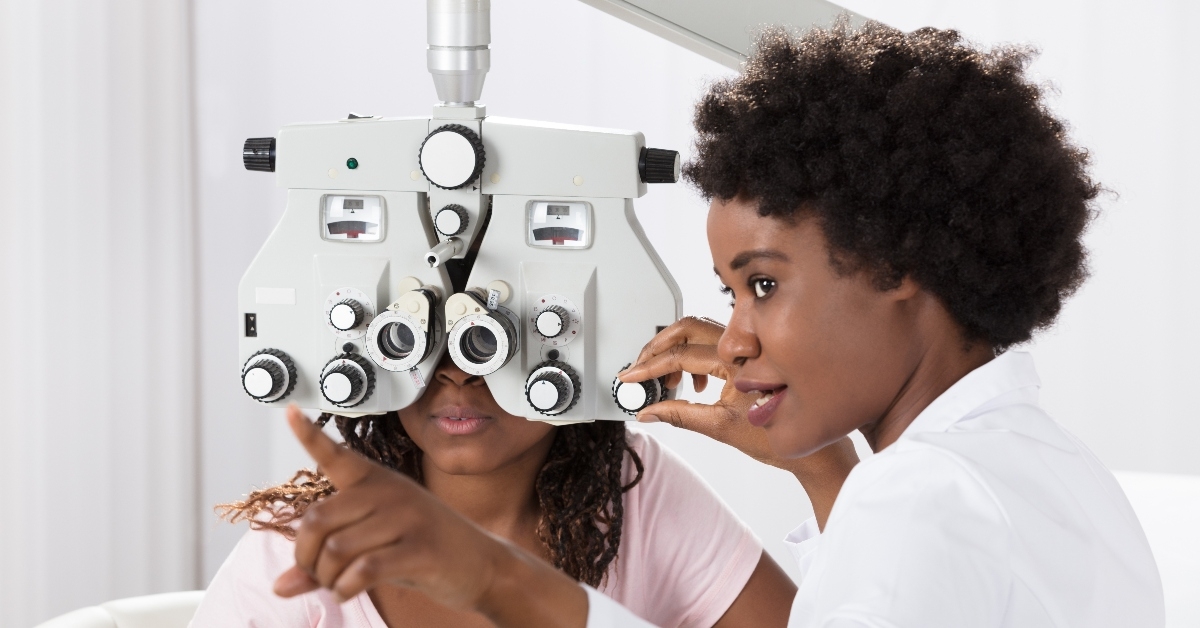 Eye doctor giving exam