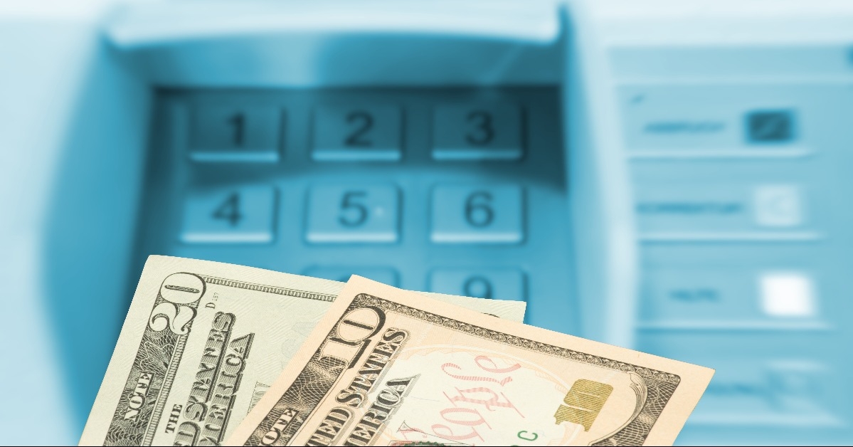 cash in front of ATM machine