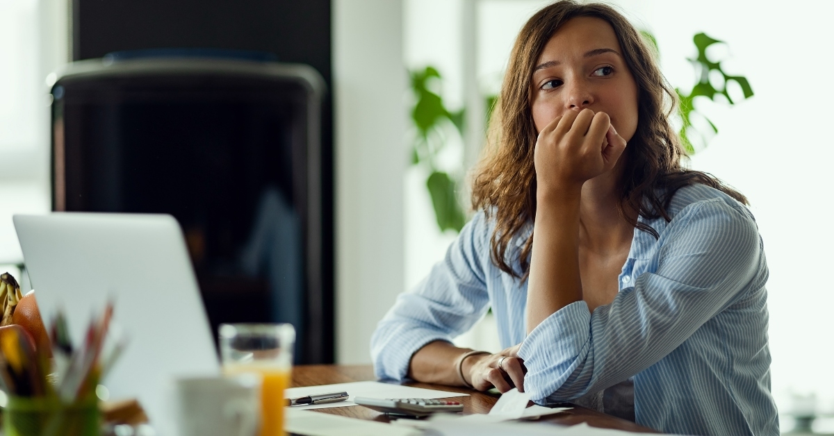 Woman thinking about bills