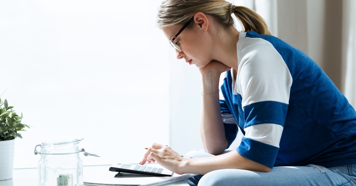 Woman using calculator