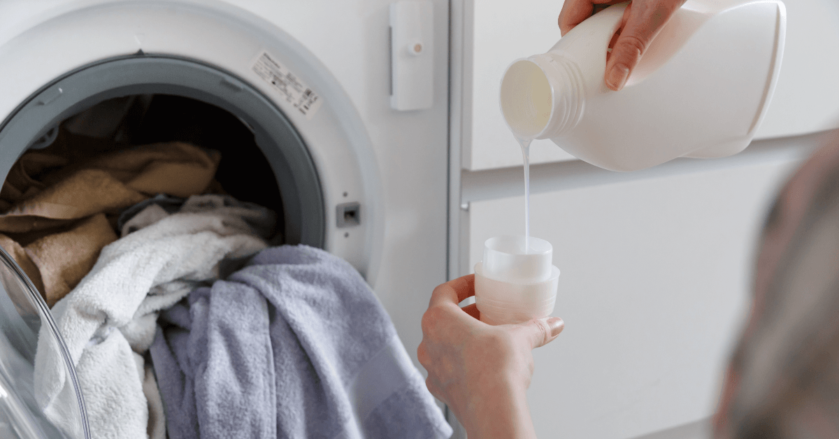 pouring laundry detergent
