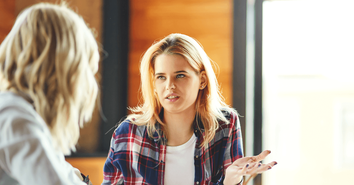 Two women discussing saving