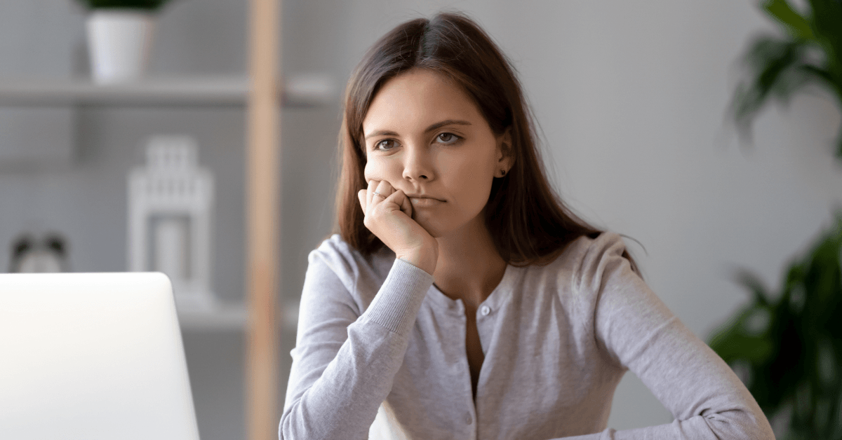 Underemployed woman bored at work