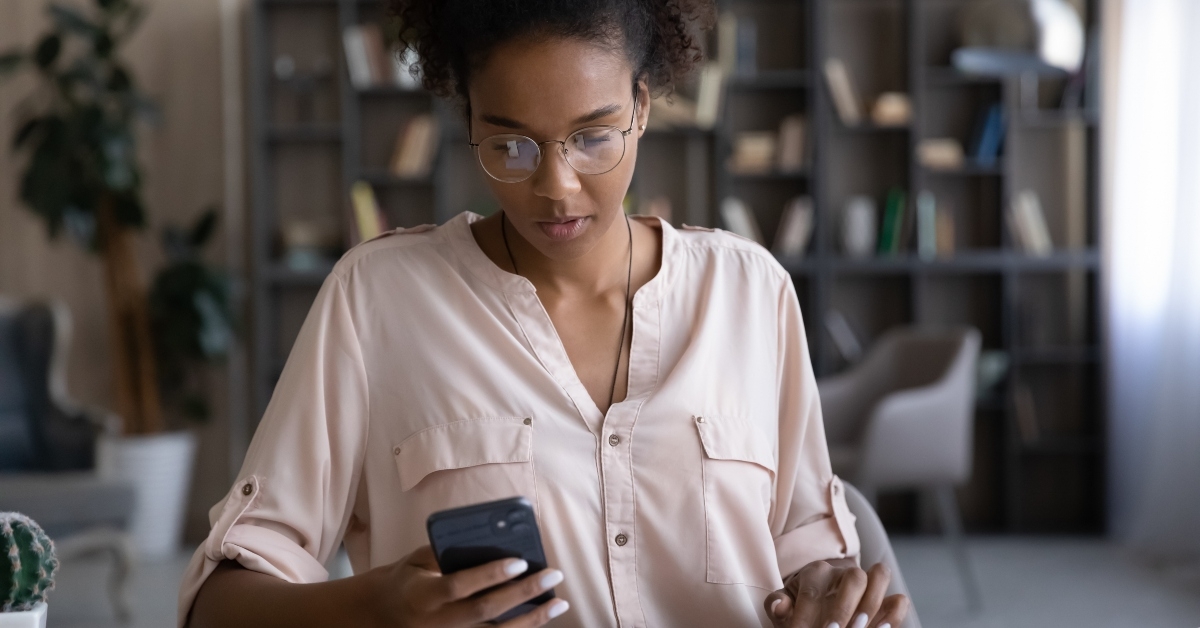 Woman using calculator