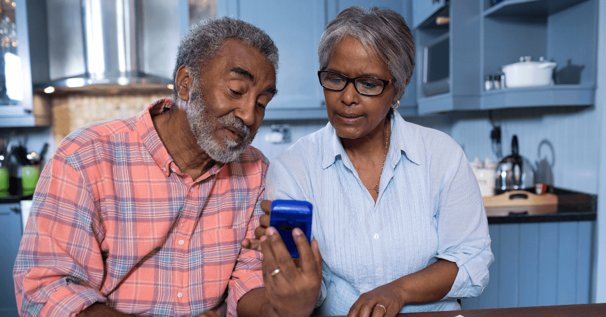 Couple using calculator