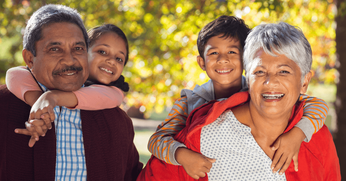 Grandparents piggybacking grandchildren