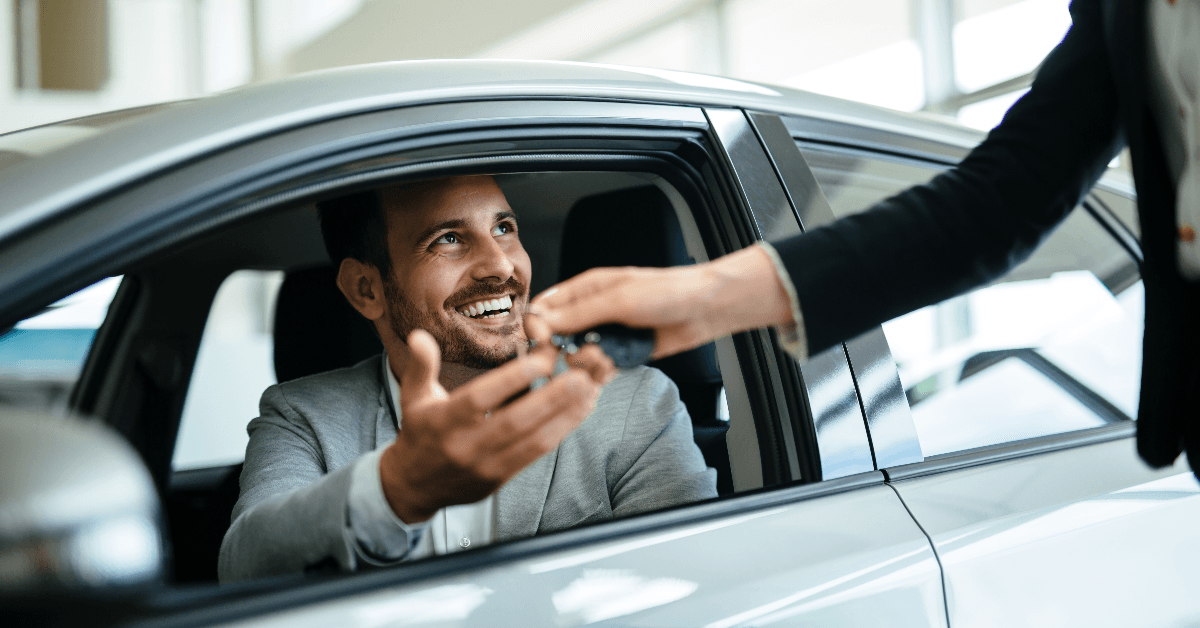 Happy man buying car
