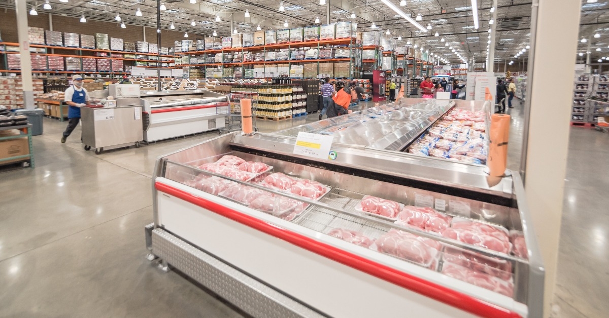 meat department and sample stand at Costco large aisle
