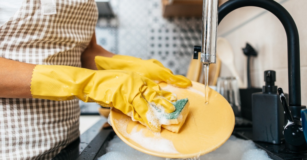 young adult woman with yellow protective gloves