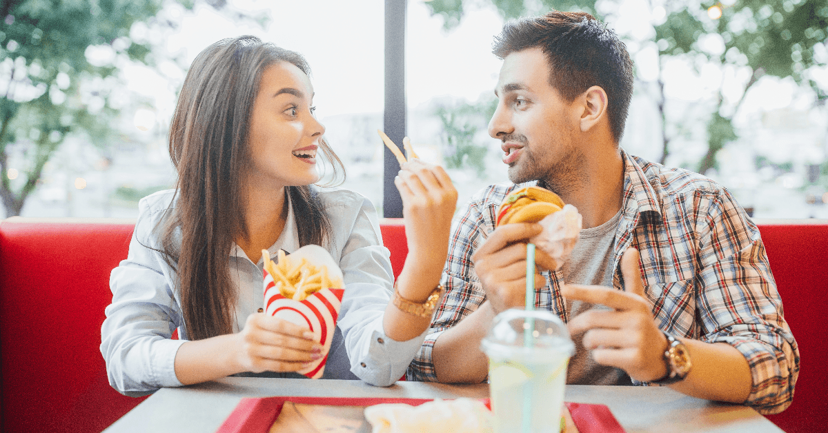 Couple eating fast food