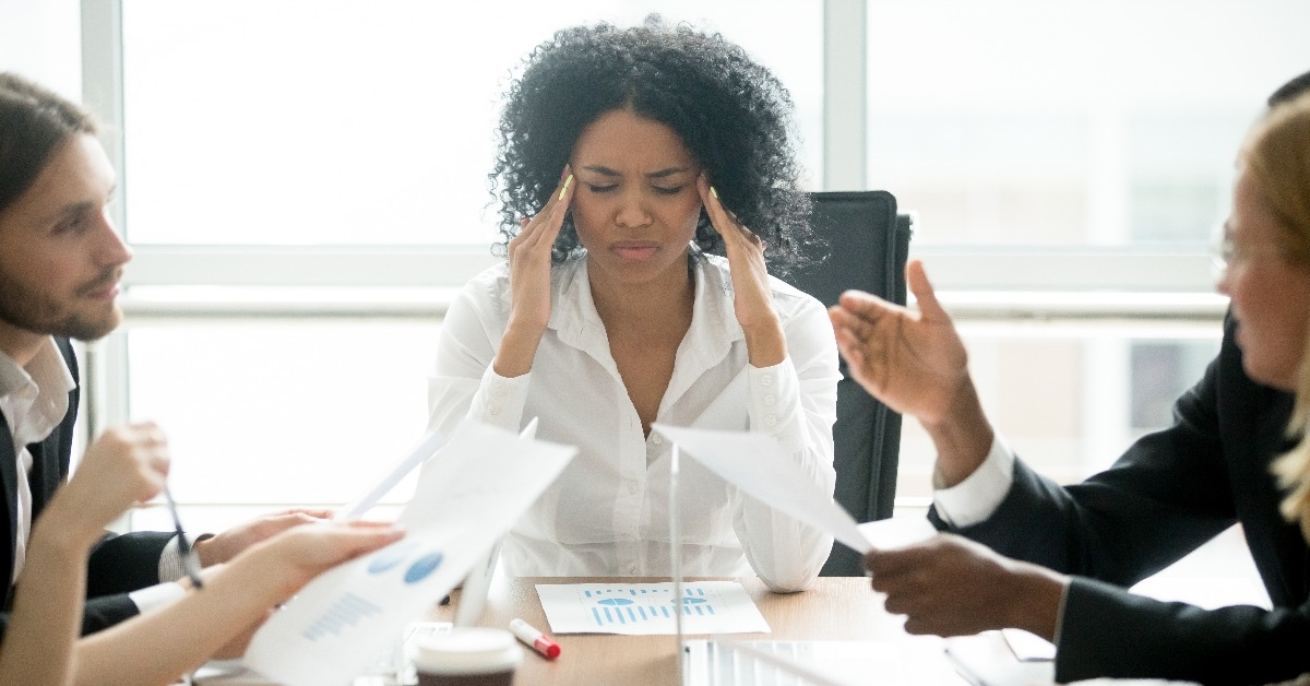 businesswoman feels tired at corporate meeting