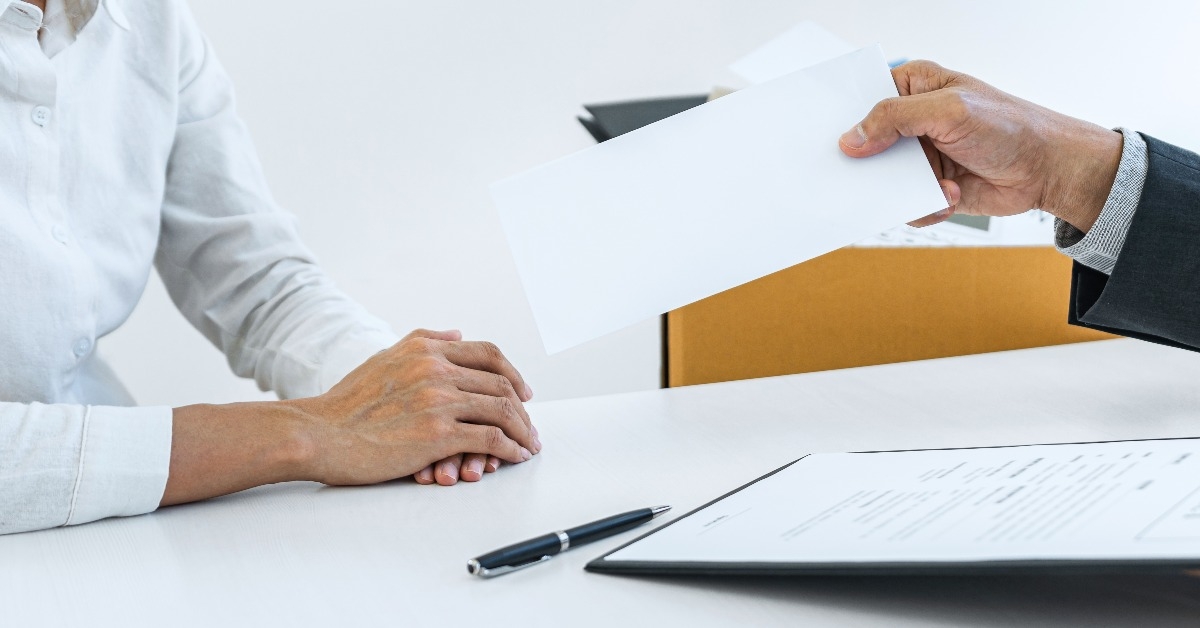 hand of employer filing resignation
