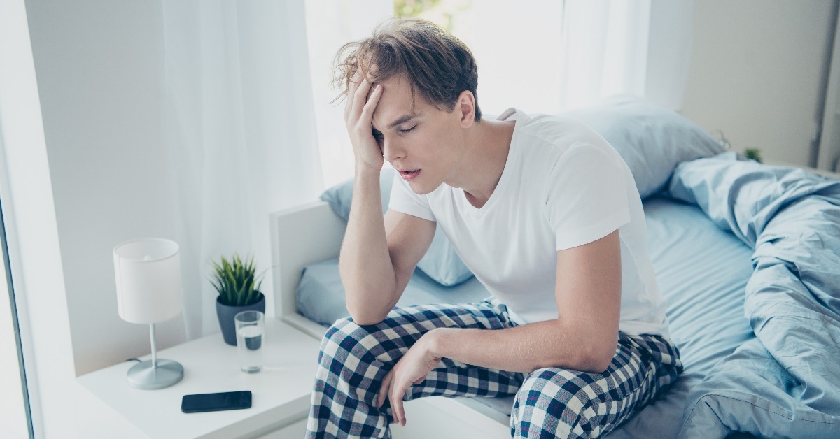 unhappy man after hangover party