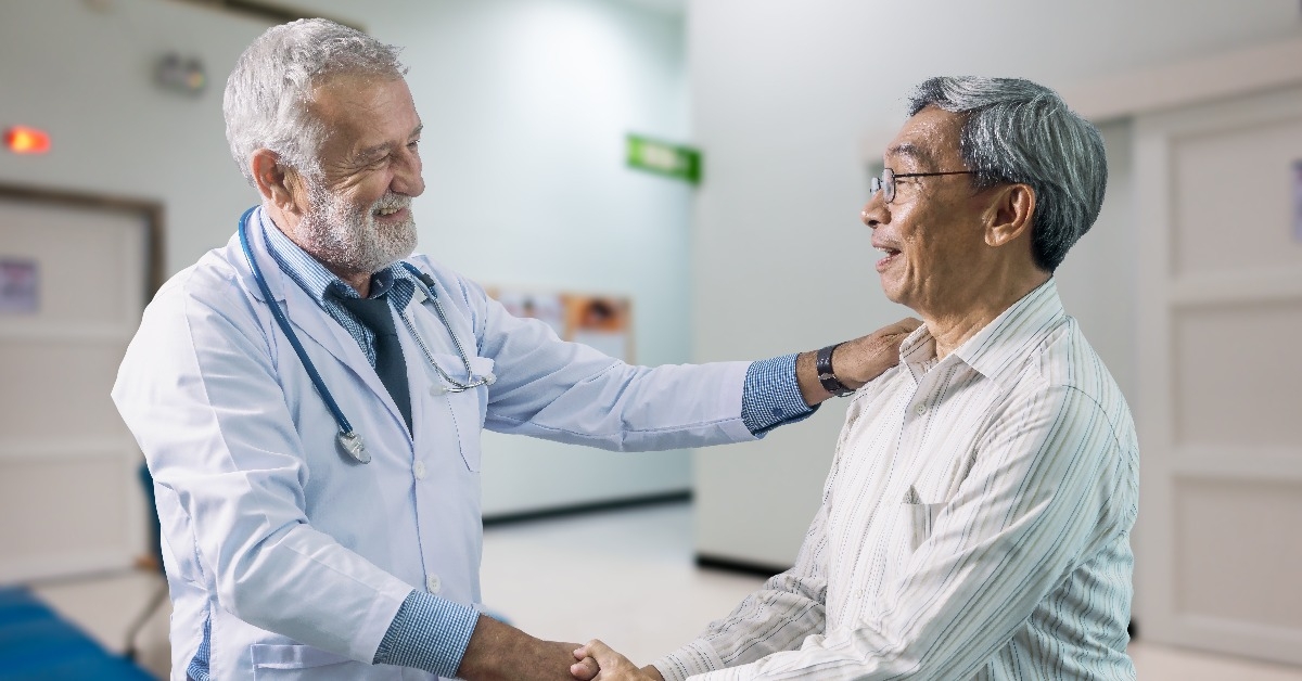 senior doctor and elderly patient happiness together