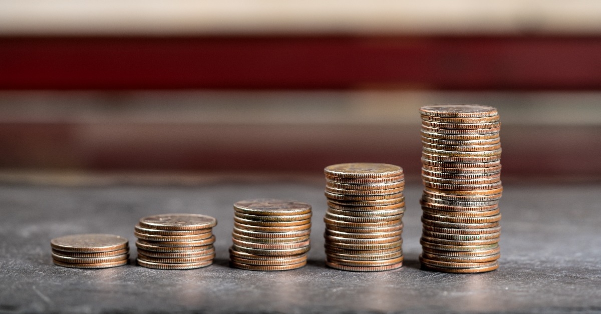 pile of US quarters growing with compound interest