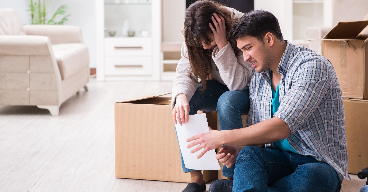 young couple receiving foreclosure notice letter