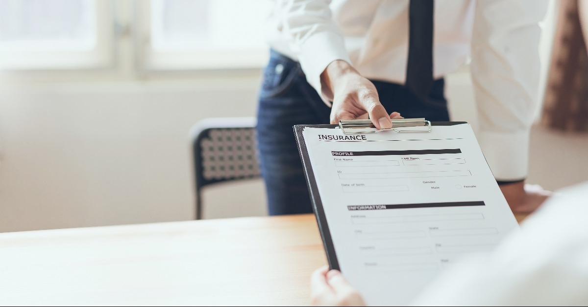 businessman in the office fill out insurance policy