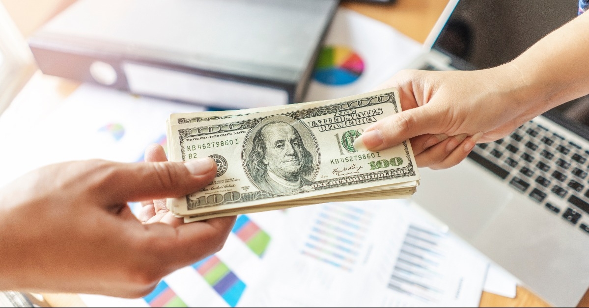 businessman receiving money bills