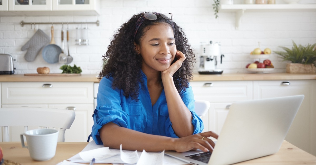 afro american woman paying bills for rent