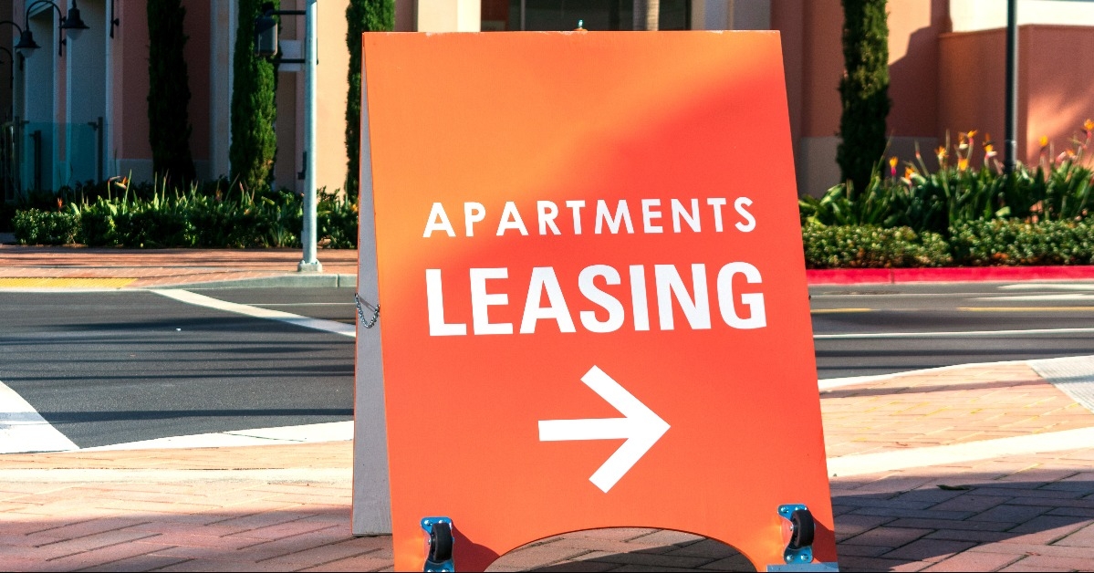 apartments leasing sign promotes the rental property