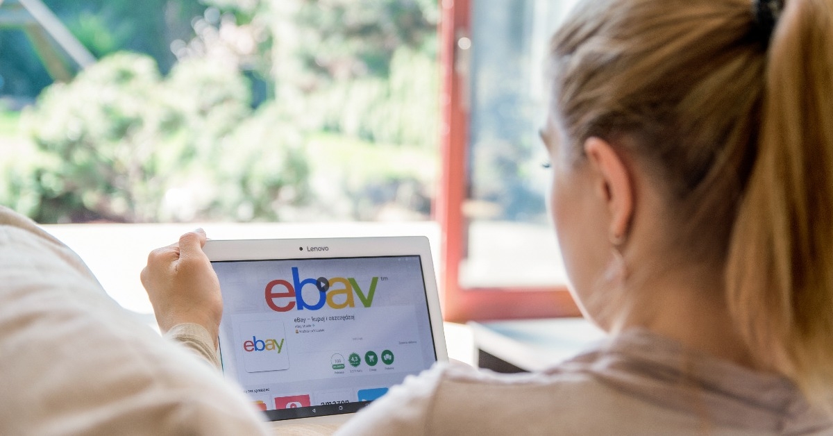 woman is installing ebay application on Lenovo tablet