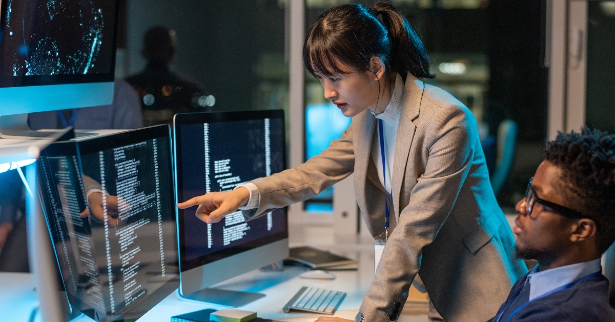 Colleagues working on computer