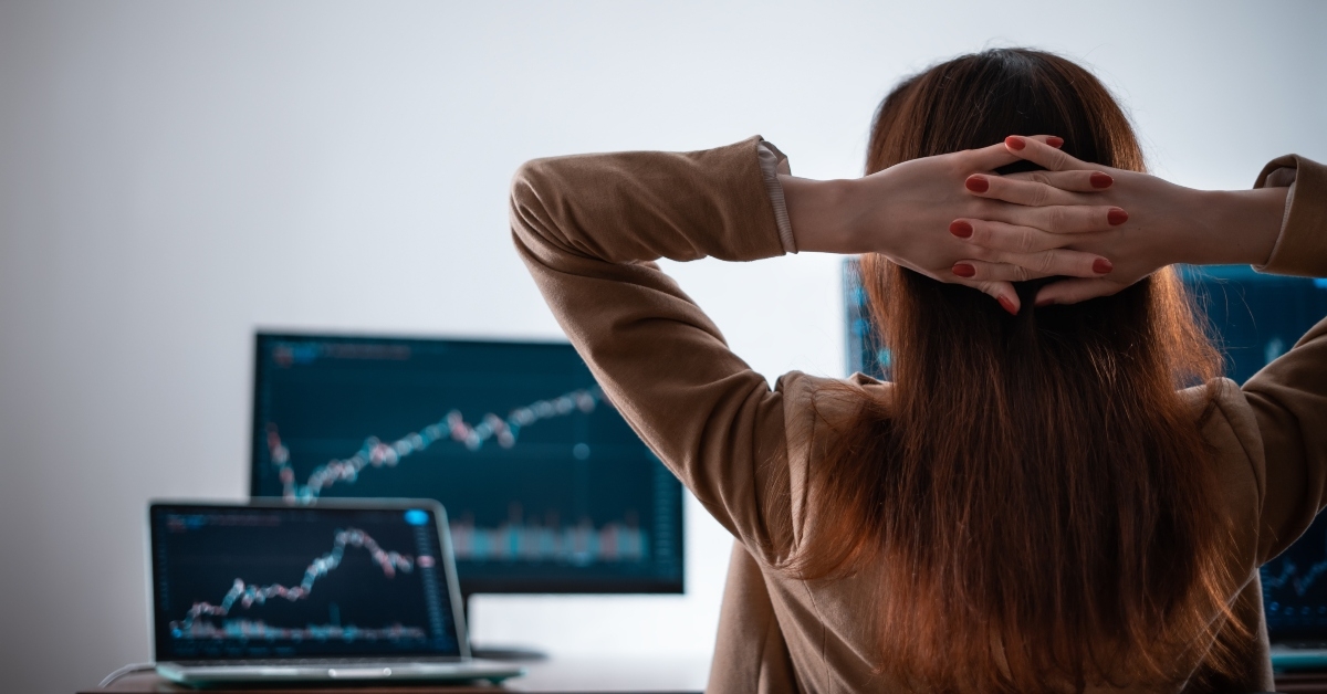 Woman looking at computer screens
