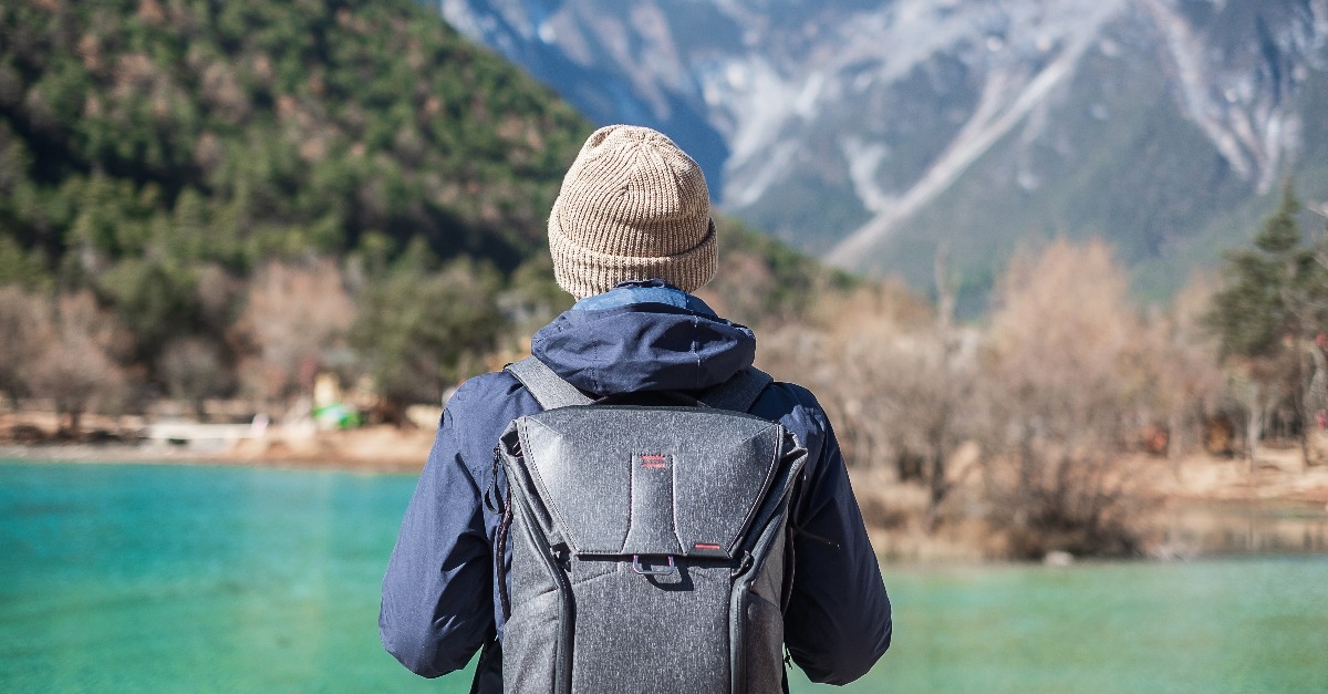 young man traveler traveling at Blue Moon Valley