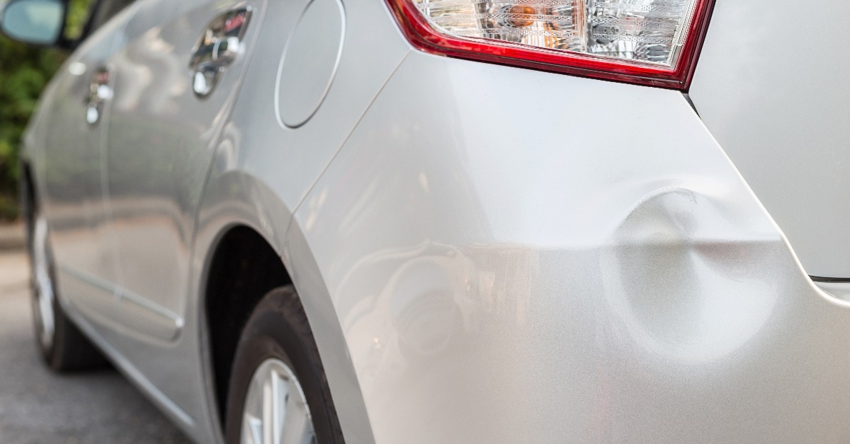 backside of silver car get damaged by accident