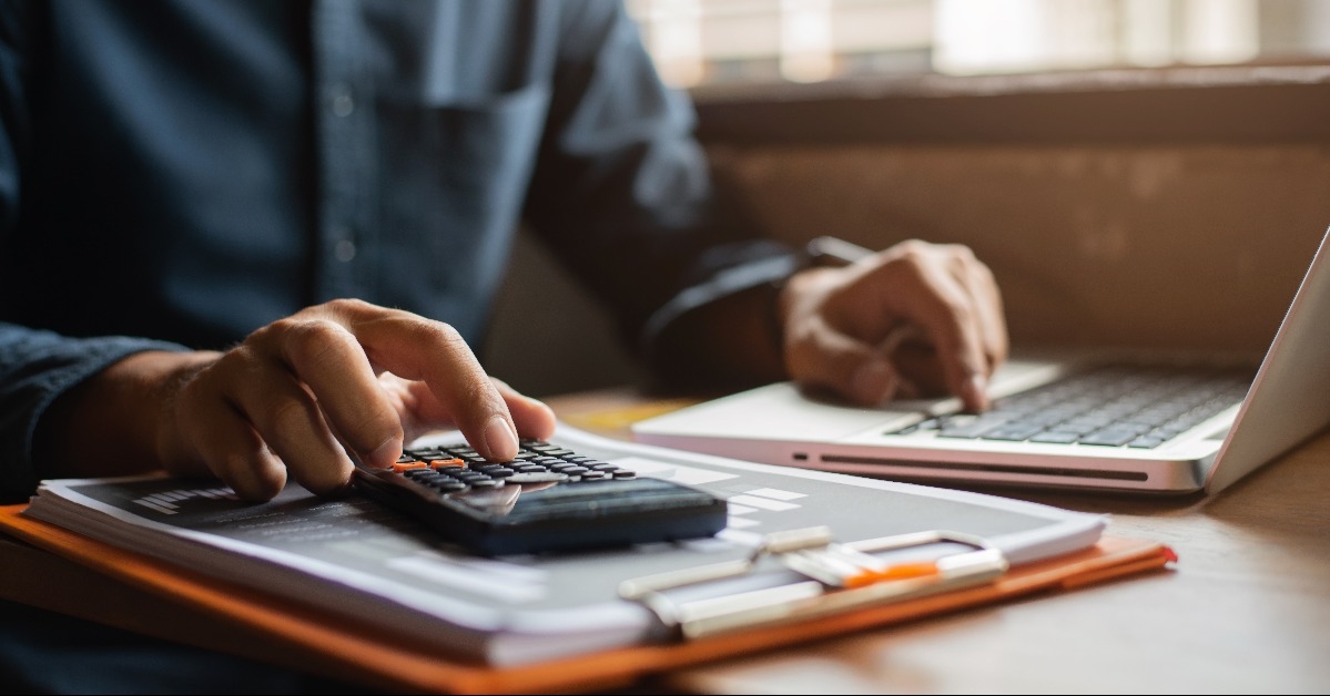 hands of a businessman calculating finances