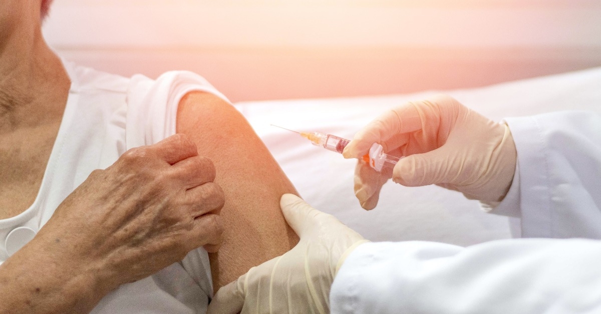 elderly getting immune vaccine at arm for flu shot