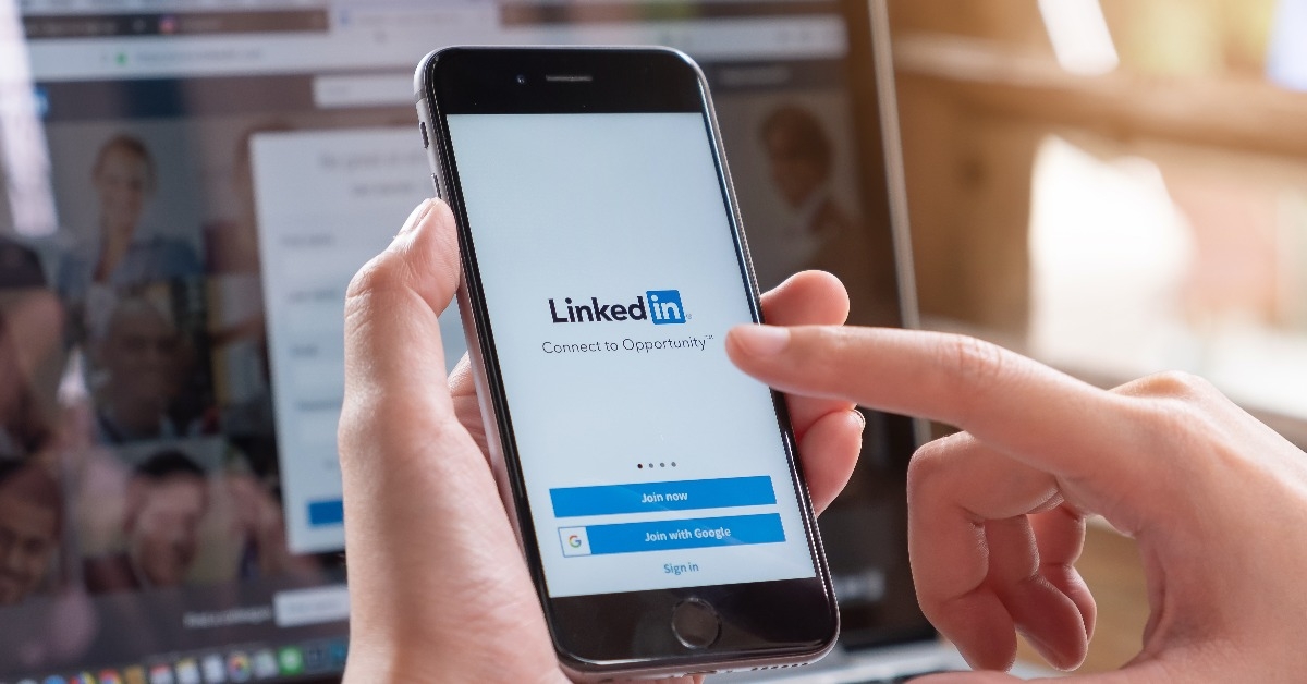 iPhone X with LinkedIn application on the screen