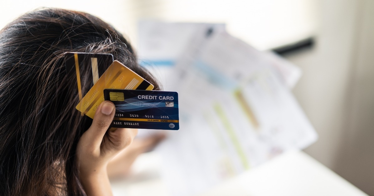 asian young woman being stressed about her credit card debt problems