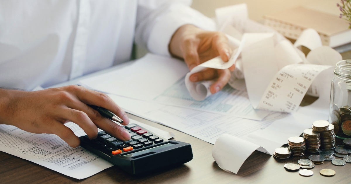 man calculate domestic bills at home