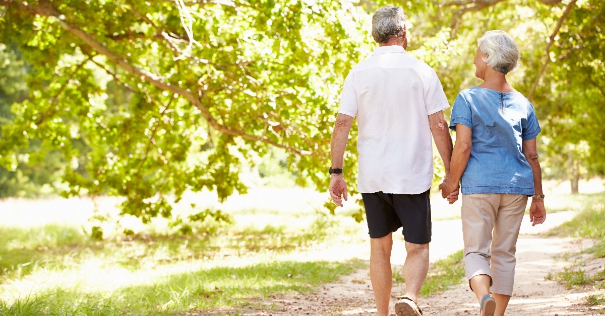 Senior couple walking together in the countryside