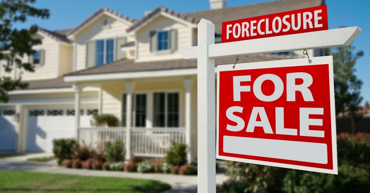 foreclosure real estate sign and house