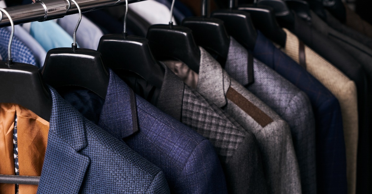 Mens suits on hangers in different colors