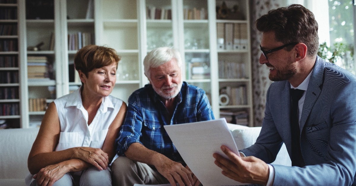 Senior couple planning their investments with financial advisor