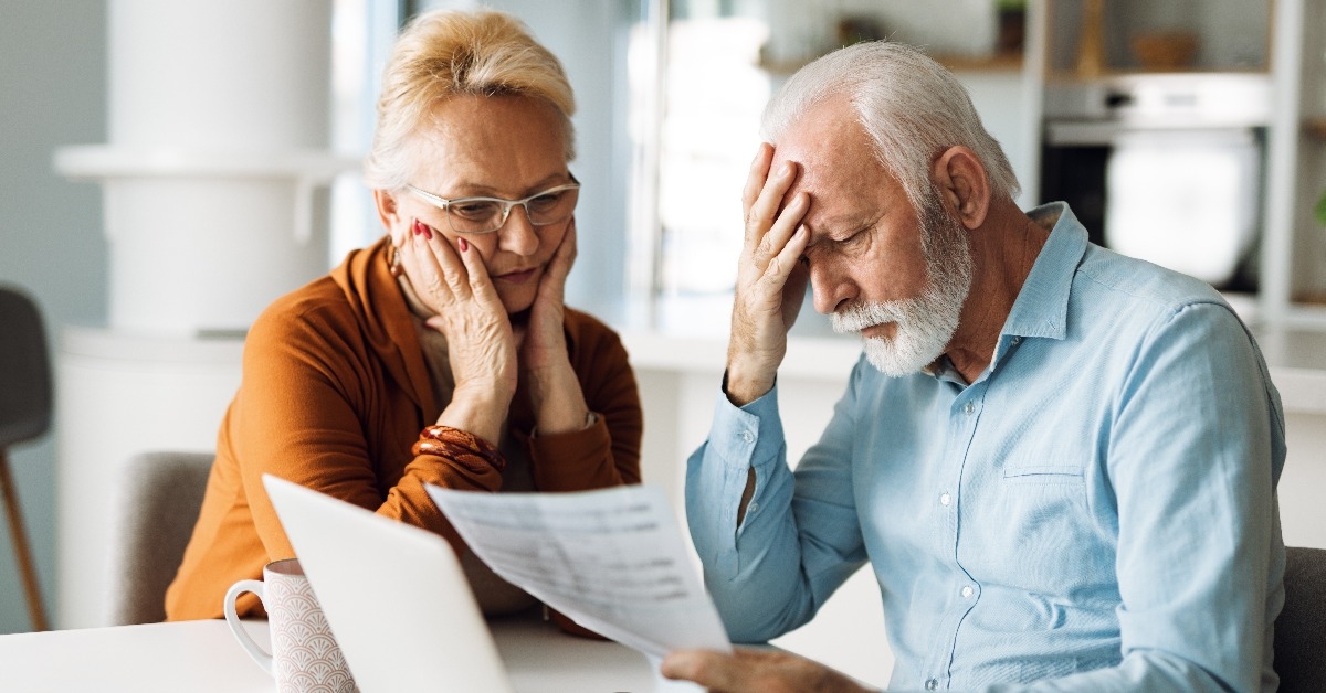 Worried senior couple feeling stressed 