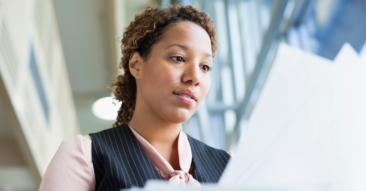a woman is reviewing documents