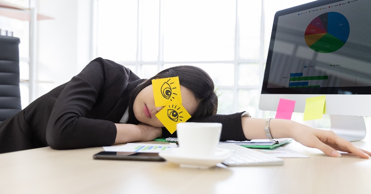 businesswoman in black suit tired frustrated from working at the computer screen