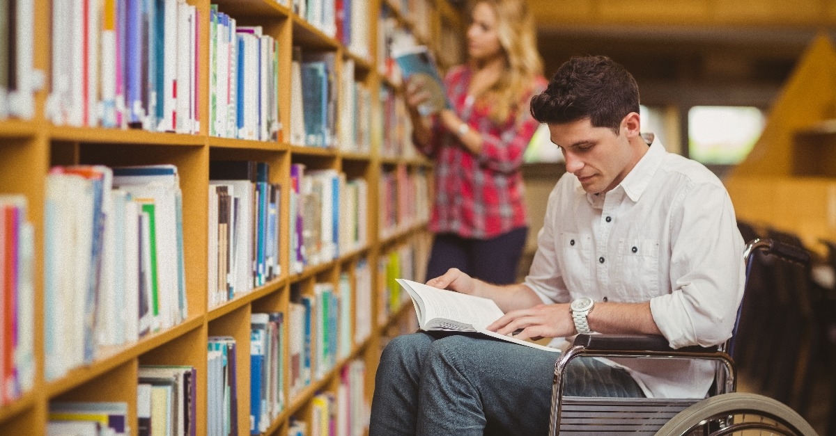 Student in wheelchair talking with classmate