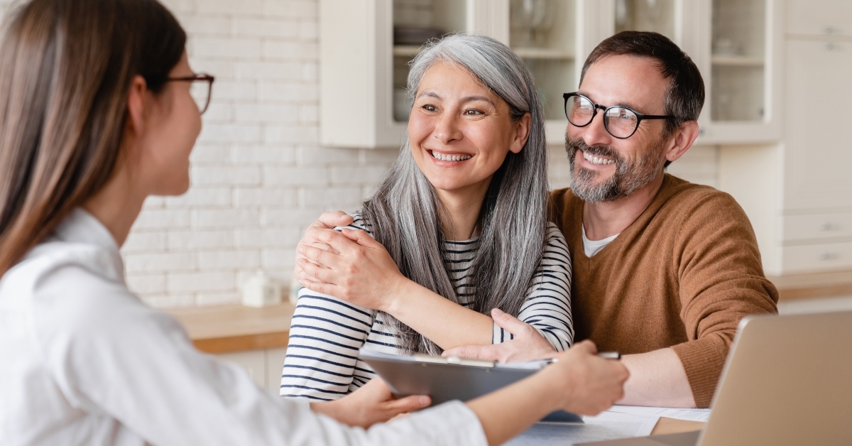 Couple talking with woman